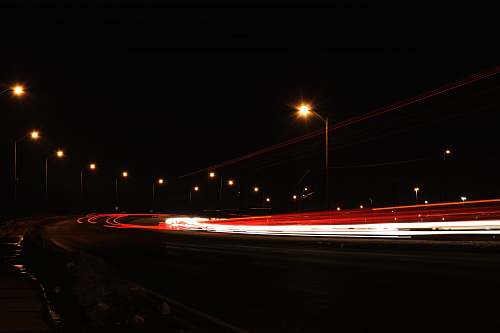 tail light timelapse photography of vehicles during nighttime head light